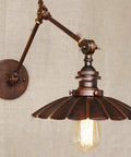 Industrial Wall Sconce With Built In Toggle Switch Sets The Mood For Cozy Bedroom Lighting Boasting Solid Cast Iron Construction Nailing That Vintage Vibe For Kitchen Or Living Room High Grade Metal Frame Drips With Rustic Charm, featuring an ornate round shade and adjustable arm.