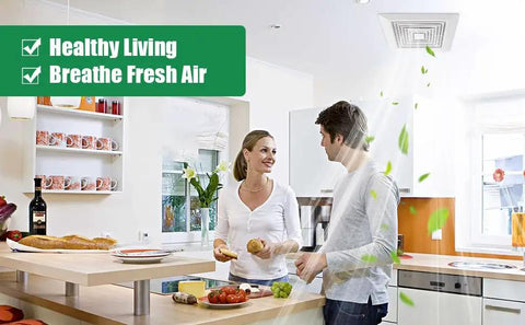 Couple in kitchen with Spring Loaded Bathroom Exhaust Fan Cover showing healthy living benefits, fresh air with ceiling fan installed.
