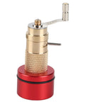 Brass mainspring winder from Mainspring Winder Set With Storage Box For Watches, showing knurled handle and red base.