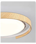Chandelier Light, Modern Invisible Ceiling Fan with Light for Bedroom, Acrylic Bladeless Wood design, close-up view of wooden edge.