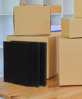 4 Pack Pick And Pluck Foam Inserts For Shipping And Storage Dope Soft Cushioning Padding next to cardboard boxes on a table