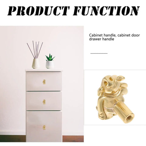 Close-up of vintage brass pig shaped drawer pulls on white cabinet, Chinese style decorative cabinet handles for small drawers.