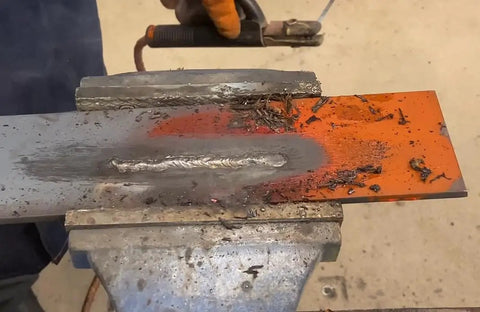 Tartan AAA Welding Electrode One Eighth Inch Diameter For Mild Steel Repairs shown welding metal with clean beads