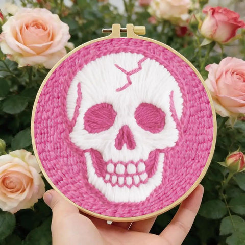 Pink Skull Head Punch Needle Kit For Adults Beginners Complete DIY Craft Needlepoint Set with hoop in garden setting.