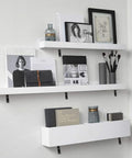 White wall shelves supported by Heavy Duty Black Steel L Shelf Brackets Set 8 Pieces 5x3 Inch Decorative Angle Braces.