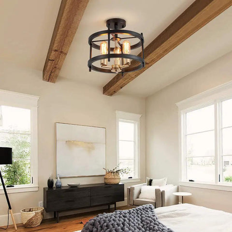 Farmhouse 3 Light Semi Flush Mount Ceiling Light Fixture in Matte Black and Gold Finish with Openwork Circle Frame in living room