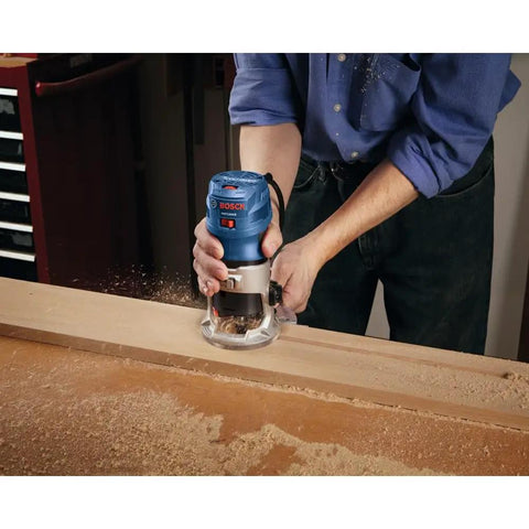 Person using Colt 1.25 HP Variable Speed Palm Router With 7 Amp Motor for precise detail work in woodworking project.