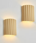 Indoor Hardwired Up and Down Cream Wall Sconce Set of 2 Modern LED 3000K, cream resin wall sconces with ribbed design.