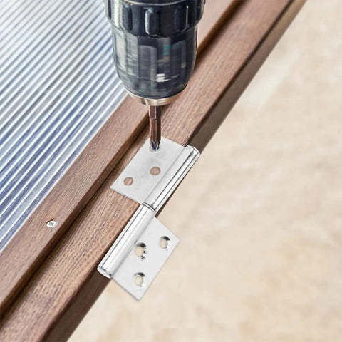 Close-up of drill installing stainless steel lift off door hinge from set of 10 for doors and wardrobes, detachable flag shaped hinge.