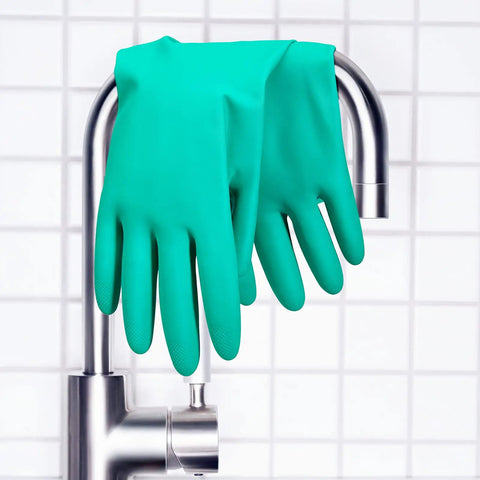 Top Tier Chemical Resistant Nitrile Gloves Medium Single Pair hanging on faucet, showcasing chemical protection and grip.