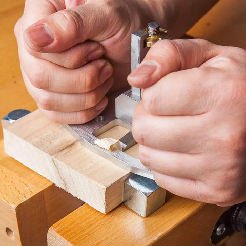 Close-up of hands using Router Plane Hand Tool With Depth Stop and Base Holes Pro Grade 8mm Blade for precise woodworking.