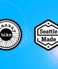 Low Odor Bike Degreaser For Chains And Parts Cleaners, logo with 'runaway bike' and 'Seattle Made' badges on blue background.