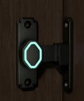 Premium Aluminum Sliding Barn Door Lock Featuring 90 Degree Flip Security Latch With Hella Sturdy Heavy Duty Build For Smooth Interior Patio Gates And Room Dividers on a dark wood door.