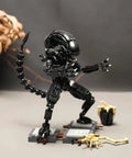 Xenomorph Action Figure Building Set With 616 Pieces, Lego Size Compatible Halloween Model, Great For Collectors And Family Fun, Step By Step Instructions For Easy Assembly And Creative Play. Black Lego-size xenomorph figure on display stand