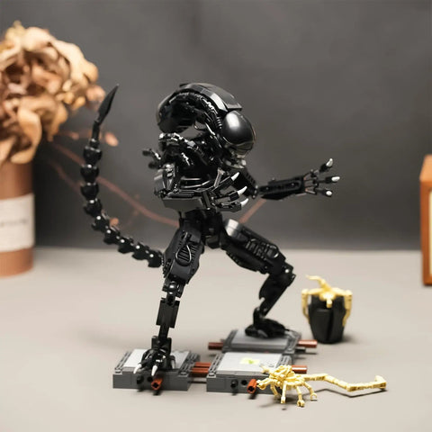 Xenomorph Action Figure Building Set With 616 Pieces, Lego Size Compatible Halloween Model, Great For Collectors And Family Fun, Step By Step Instructions For Easy Assembly And Creative Play. Black Lego-size xenomorph figure on display stand