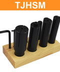 8 Piece Expanding Arbors Set For Lathe And Milling Machines One Quarter Inch To One And One Quarter Inch Capacity Mandrels Built To Last With A Workhorse Grip For Ring Mandrel Work And Smooth Tight Fits. black expanding arbors on wood base with hex key
