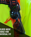 Tinted Safety Glasses 12 Pack ANSI Z87 Plus UV Eye Protection for Construction attached to high-visibility vest, focus on nose bridge.