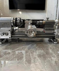 Mini Lathe Machine With 50Mm Chuck And Stepless 0 To 2000 Rpm Speed For Precision Wood And Metalworking Projects on a marble surface.