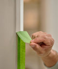 Applying Multi Surface Painter's Tape With PaintBlock Technology Pro Grade 1 Inch Wide 0.94 In By 60 Yds Green on trim