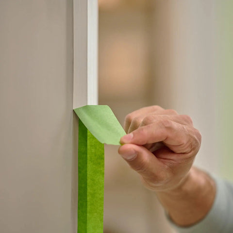 Applying Multi Surface Painter's Tape With PaintBlock Technology Pro Grade 1 Inch Wide 0.94 In By 60 Yds Green on trim