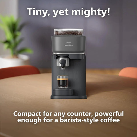 Front view of Baristina Espresso Machine With Automatic Grinder Grind Tamp And Brew In One Swipe 16 Bar Pump Compact Black Coffee Maker For Home Or Office Use No Fuss Busy Mornings And Rich Crema on a table with espresso shot