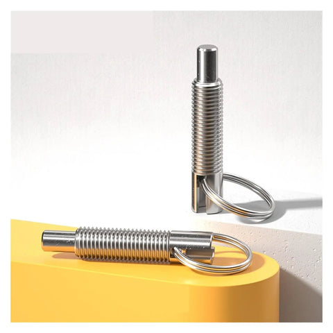 Real Slick Stainless Steel Locating Pin With Hand Retractable Spring Indexing Plunger M6 Lock Ring for workshop projects, displayed on a yellow surface.