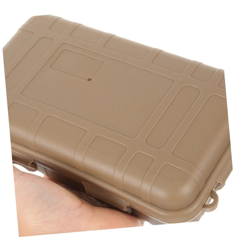 Tan case from Three-Piece Survival Storage Case Set for Outdoor Junkies Ultra-Tough Shockproof and Sealed Organizer shown in hand
