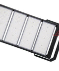Badass 1000W LED Stadium Flood Light Featuring Rock Solid Aluminum Housing And DLC Certified Seoul LED Modules For Tough Outdoor Parking Lots And Industrial Work Sites Built Like A Tank For High Performance Ground Mount Lighting, angled view.