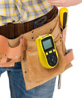 Yellow portable carbon monoxide detector with 0 to 1000 PPM range clipped to a tool belt, showing the easy-read LCD display.