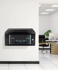 Rock Solid 4U Wall Mount Server Cabinet With Clear Glass Door Network Rack Enclosure on wall in office setting.