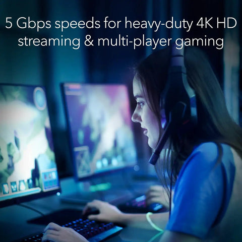 Person gaming on computer with WiFi 7 Range Extender EXS27 That Covers Up To 1,500 Sq Ft And 45 Devices With BE5000 Dual Band