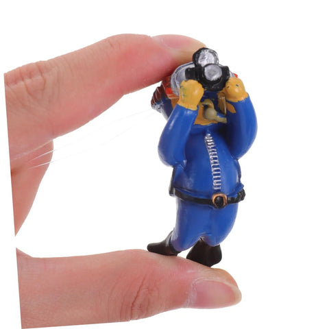 Detailed view of a Two Pack Floating Diver Ornaments For Aquariums figurine held in hand, showcasing cute underwater decor for fish tanks.