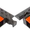 Close-up of Three Channel High Profile Drive Over Cable Protector for heavy duty loads with polyurethane construction, orange and black.