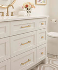 Champagne Bronze Destine Cabinet Pull 5-1/16 Inch Center-To-Center on white bathroom drawers, modern design