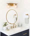 Gold Vanity Light 2-Light Fixture With Globe Clear Glass Shades For Bathroom, 16 Inch Length, over modern bathroom sink