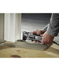 Pro Grade Corded Oscillating Multi Tool Kit 120V 3.5 Amp Power, Reconditioned, cutting flooring near doorway