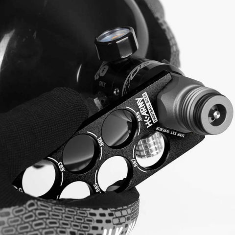 Paintball Ball Sizer Guide with 9 Machined Aluminum Gauges and laser engraved sizes, includes extender wrench and carabiner.