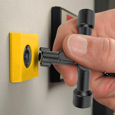 4-Way Universal Utility Cabinet Key in black unlocking a gas meter, close-up view, compact and durable tool for home and garage use