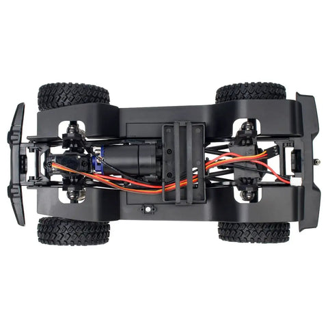 Bottom view of Hardcore Nylon Crawler Chassis Frame With Gearbox Assembled Upgrade Kit For One Eighteenth Scale RC Crawlers Like Bronco Defender AX8562 Durable Steel Rails, showing wheels and wiring.