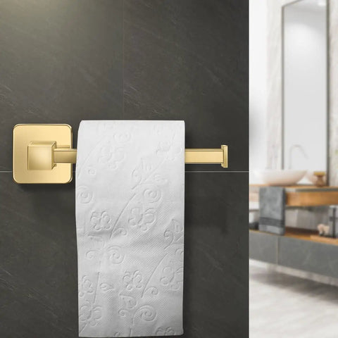 Gold Finish 4 Piece Bathroom Hardware Set With 17 Inch Towel Bar, Towel Ring, Robe Hooks And Toilet Paper Holder on dark wall