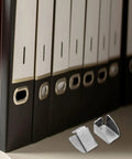 Heavy Duty Silver Adjustable Pilaster Shelf Clips Pack of 30 for Metal and Wood Shelves in front of file binders