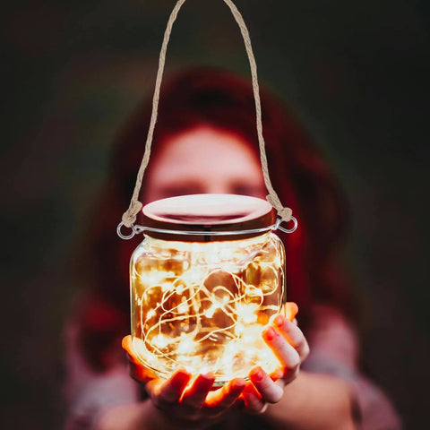 Jar with glowing lights held by a person, using 5 Pcs Metal Jar Handles And Wire Hangers For Mason Jars With Universal Hemp Rope