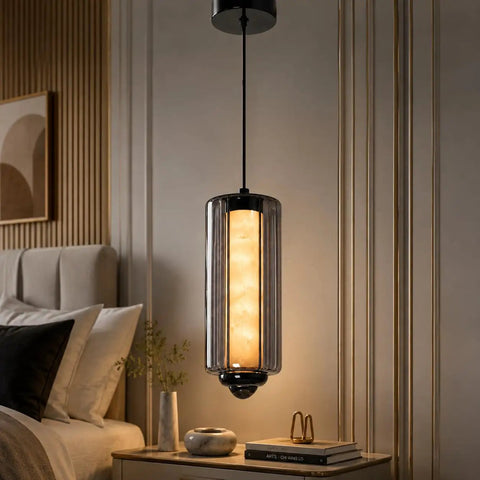 Alabaster Pendant Lights, Smoky Gray Glass Pendant Light Fixtures hanging over a bedside table with soft illumination.