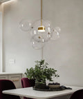 Modern LED Globe Pendant Light With Four Bubble Glass Orbs, Dimmable, over dining table, warm-cool vibe, gold-clear bubble design