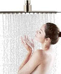 Woman enjoying water flow from Matte Black Shower Faucet Set with 12 Inch LED Square Rain Shower Head