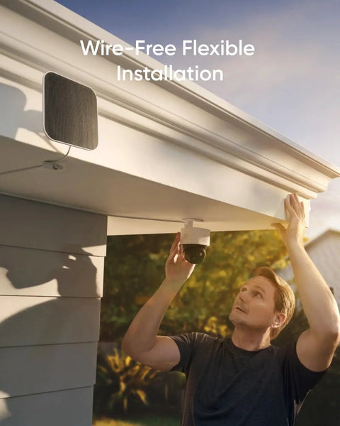 Person installing SoloCam S340 4 Cam Kit With HomeBase S380 Solar Powered Wireless Outdoor Cameras under roof eave.