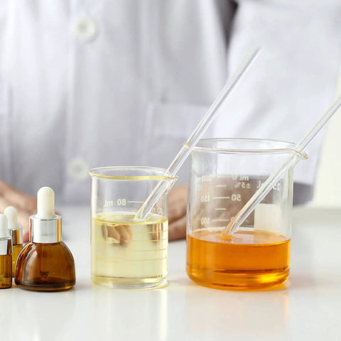 Two Pack Glass Sticks For Electrostatics Experiments Teaching Kit in beakers with yellow and orange liquids in a lab setting