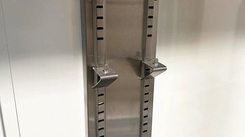 Close-up of adjustable wire rack support for Top Shelf Commercial 3 Door Reach In Refrigerator, Built Tough Stainless Steel Display Cooler Merchandiser.