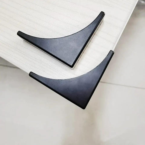 Heavy Duty Black Metal Corner Protectors Four Piece Set installed on furniture edge, black coated steel for protection against wear.
