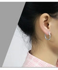 Black Titanium Hoop Earrings 2.5x10mm For Women And Men, Simple Circle Hoops, shown worn for everyday comfort